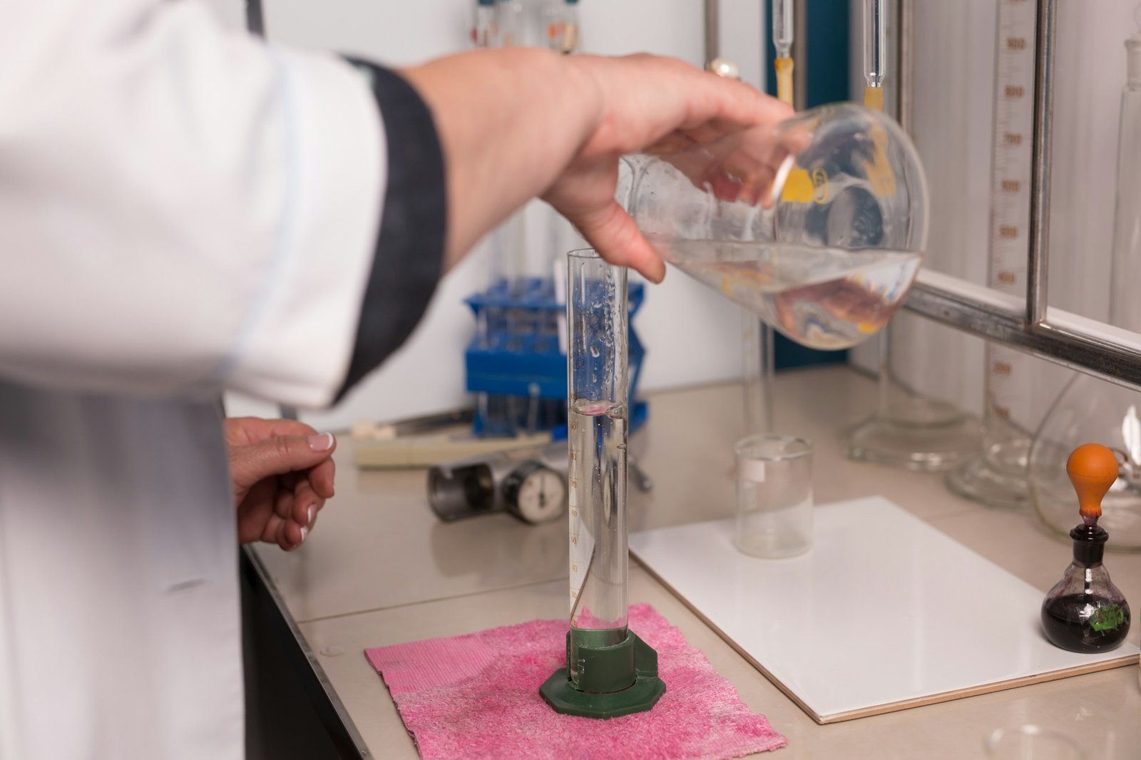 Lab technician doing chemical analysis. Testing chemical composition of the water